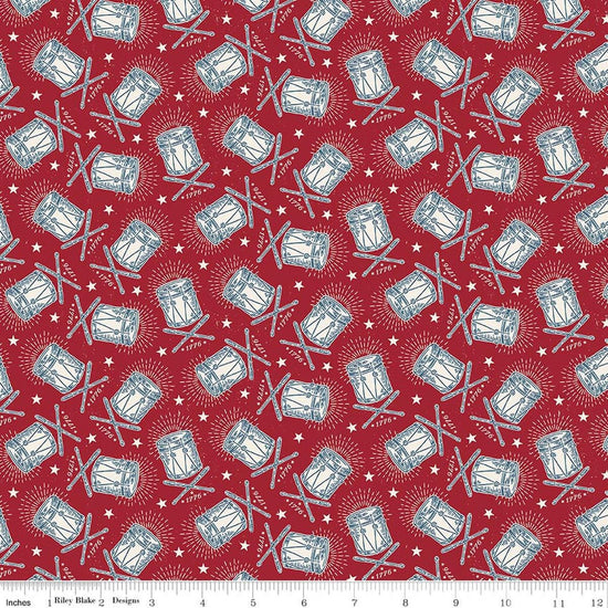 Image of Independence Drums Cherry Tart quilting cotton fabric by The RBD Designers for Riley Blake Designs. Features drums on a red background. Cute Little Fabric Shop.