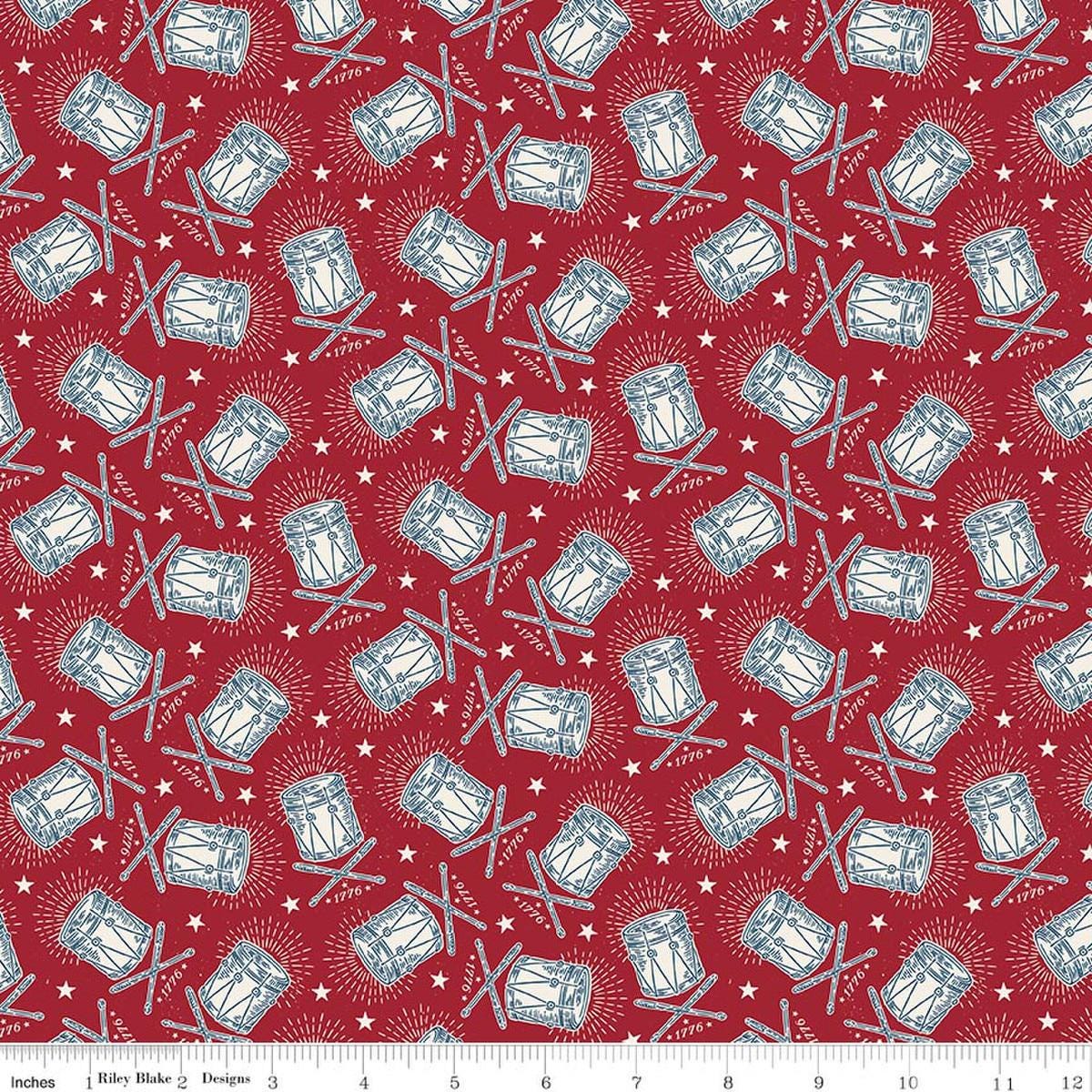 Image of Independence Drums Cherry Tart quilting cotton fabric by The RBD Designers for Riley Blake Designs. Features drums on a red background. Cute Little Fabric Shop.