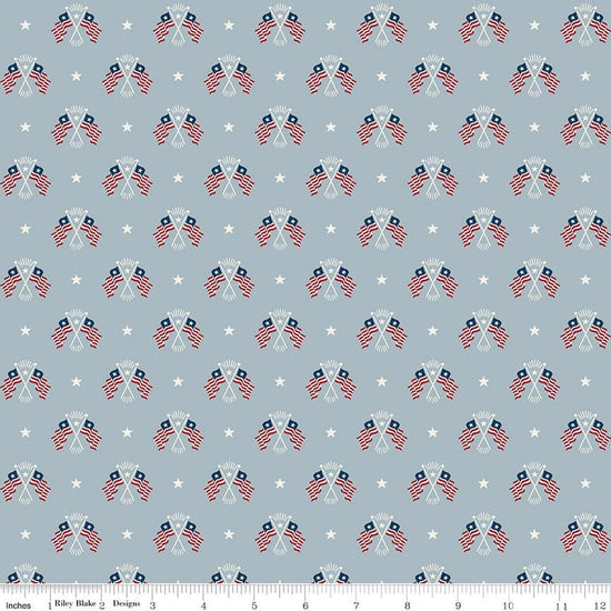Image of Independence Old Glory Blue quilting cotton fabric by The RBD Designers for Riley Blake Designs. Features flags on a gray background. Cute Little Fabric Shop.