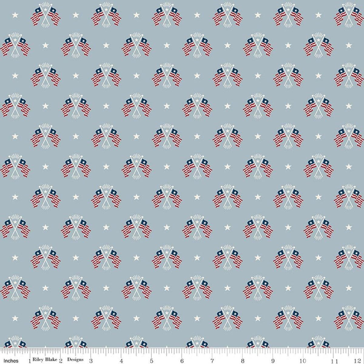 Image of Independence Old Glory Blue quilting cotton fabric by The RBD Designers for Riley Blake Designs. Features flags on a gray background. Cute Little Fabric Shop.