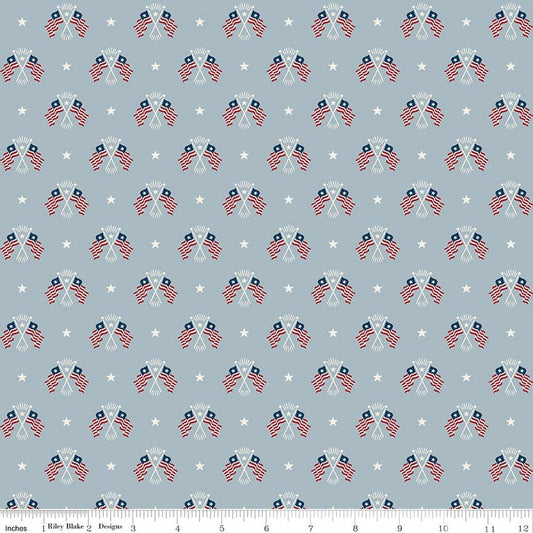 Image of Independence Old Glory Blue quilting cotton fabric by The RBD Designers for Riley Blake Designs. Features flags on a gray background. Cute Little Fabric Shop.
