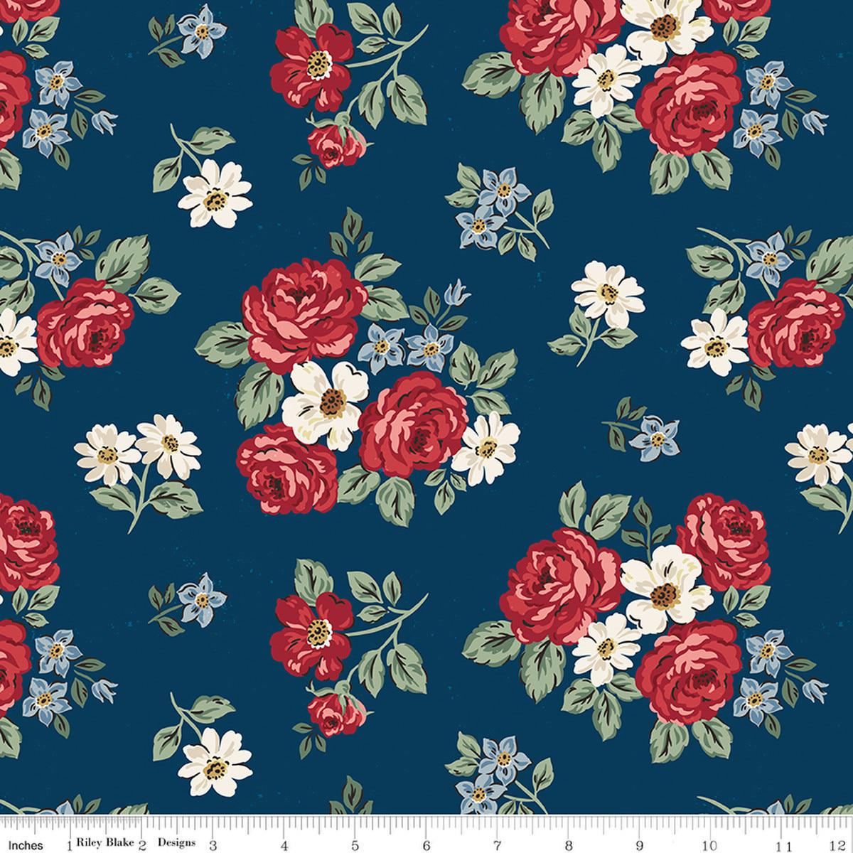 Image of Independence Floral Oxford quilting cotton fabric by The RBD Designers for Riley Blake Designs. Features flowers on a blue background. Cute Little Fabric Shop.
