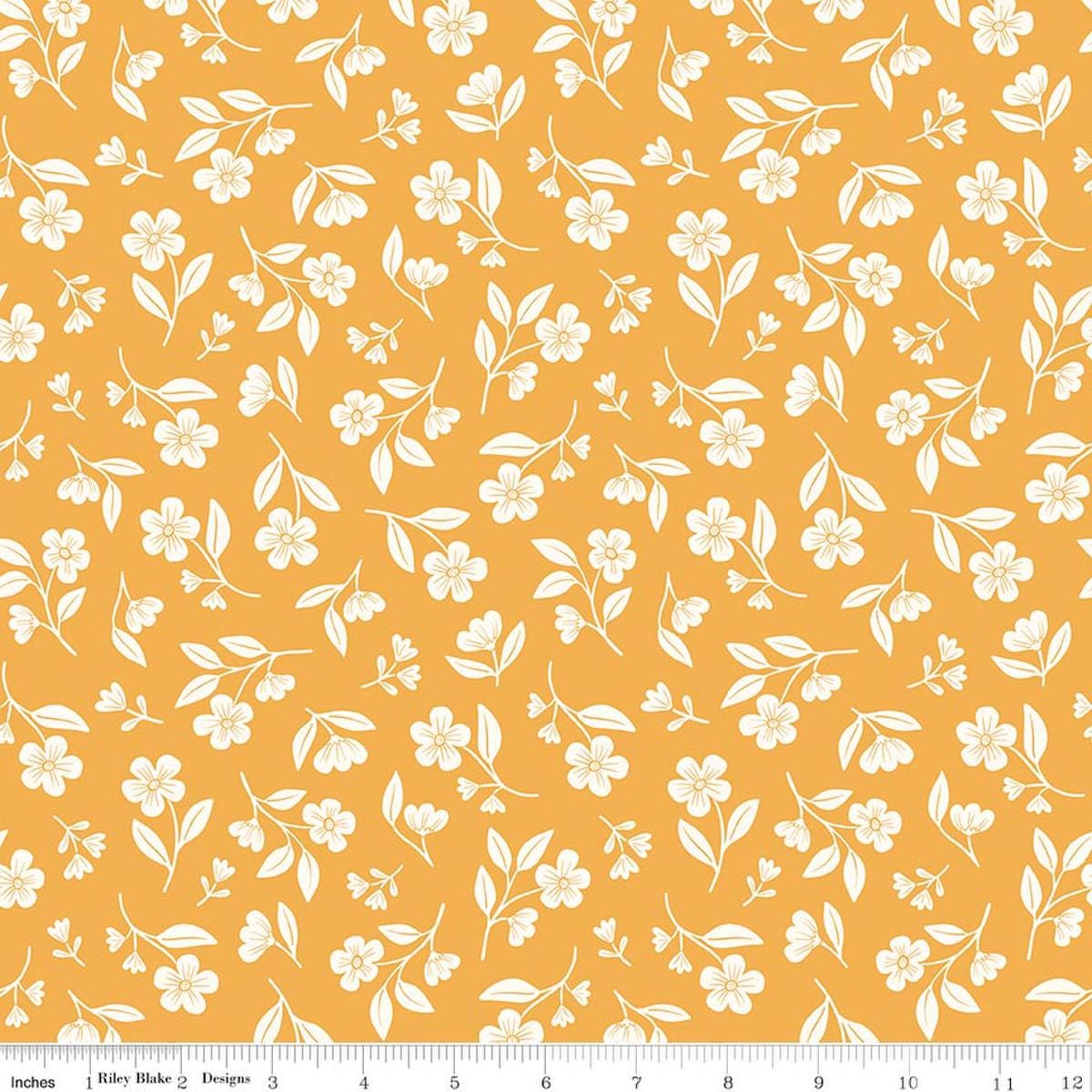 Image of Meadow Moments Drifting Blooms Yellow quilting cotton pattern by Little Forest Atelier for Riley Blake Designs. Features flowers on a yellow background. Cute Little Fabric Shop.