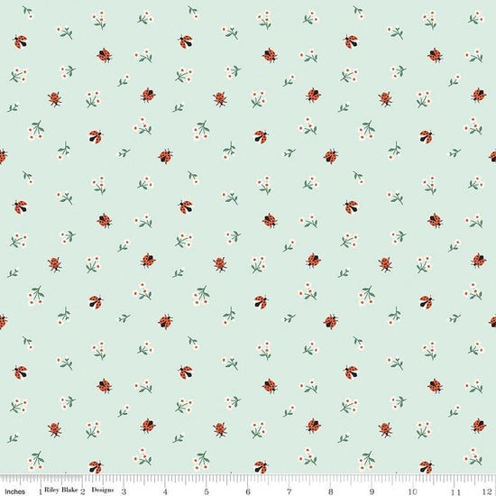 Image of Meadow Moments Ladybugs Mint quilting cotton pattern by Little Forest Atelier for Riley Blake Designs. Features flowers on a green background. Cute Little Fabric Shop.