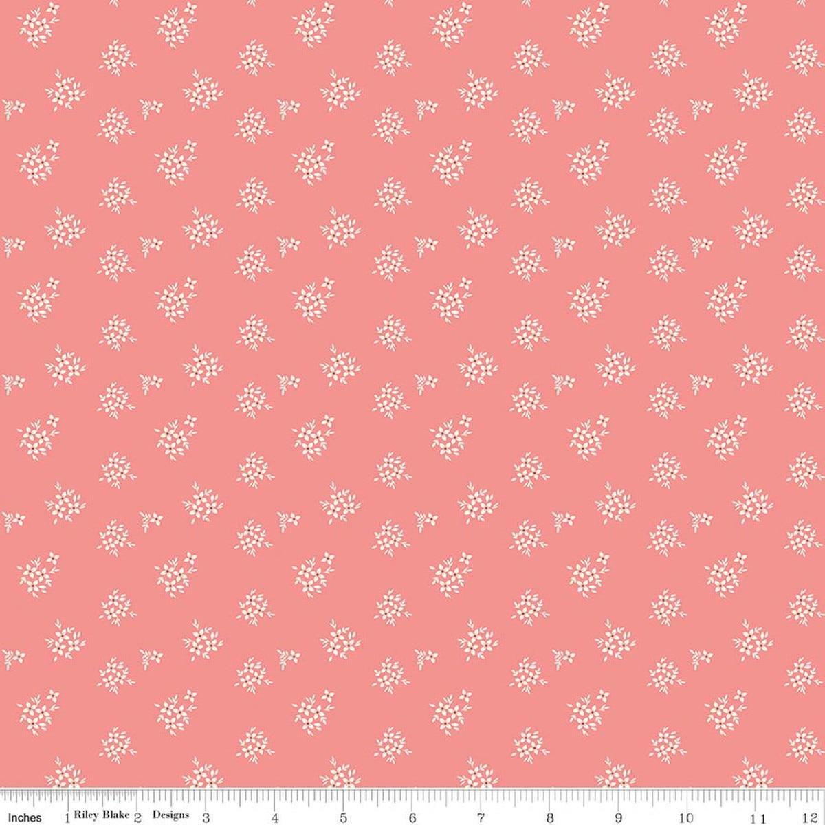 Image of Renew Ditsy Coral quilting cotton fabric by Sandy Gervais for Riley Blake Designs. Features flowers on a pink background. Cute Little Fabric Shop.