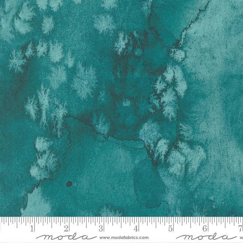 Image of Flow Basics Turquoise quilting cotton fabric by Create Joy Project for Moda Fabrics. Features abstract watercolor on a blue background. Cute Little Fabric Shop.