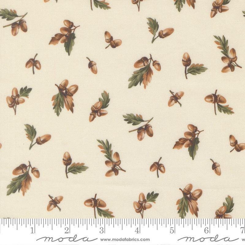 Image of Wild Blue Yonder Acorn Cloud quilting cotton fabric by Moda Fabrics. Features acorns on a cream background. Cute Little Fabric Shop.