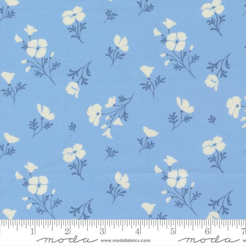 Image of Cannon Beach Astoria Sky quilting cotton fabric by Crystal Manning for Moda Fabrics. Features flowers on a blue background. Cute Little Fabric Shop.