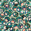 Image of Serenity Lotus Circle Vignettes Mint quilting cotton fabric by Morris Creative Group for QT Fabrics. Features flowers on a blue background. Cute Little Fabric Shop