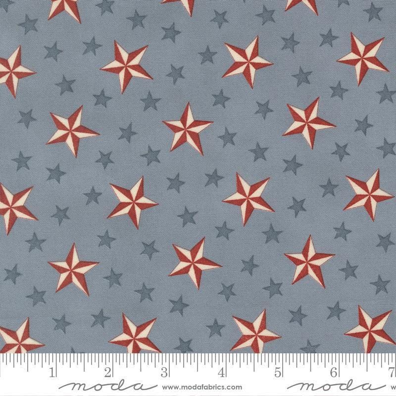 Image of America 250 Years Tossed Stars Steel Blue quilting cotton fabric by Deb Strain for Moda Fabrics. Features stars on a blue background. Cute Little Fabric Shop.