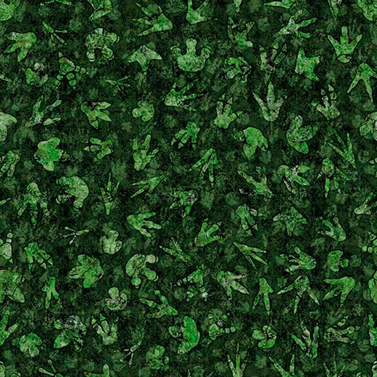 Image of Savage Kingdom Dino Tracks Forest quilting cotton fabric by Dan Morris for QT Fabrics. Features dinosaur footprints on a green background. Cute Little Fabric Shop.