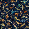 Image of Savage Kingdom Tossed Dinosaurs Dark Navy quilting cotton fabric by Dan Morris for QT Fabrics. Features dinosaurs on a blue background. Cute Little Fabric Shop.
