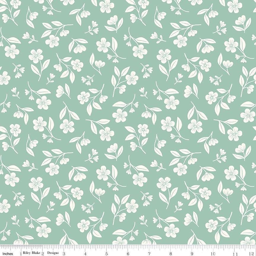 Image of Meadow Moments Drifting Blooms Mint quilting cotton pattern by Little Forest Atelier for Riley Blake Designs. Features flowers on a green background. Cute Little Fabric Shop.