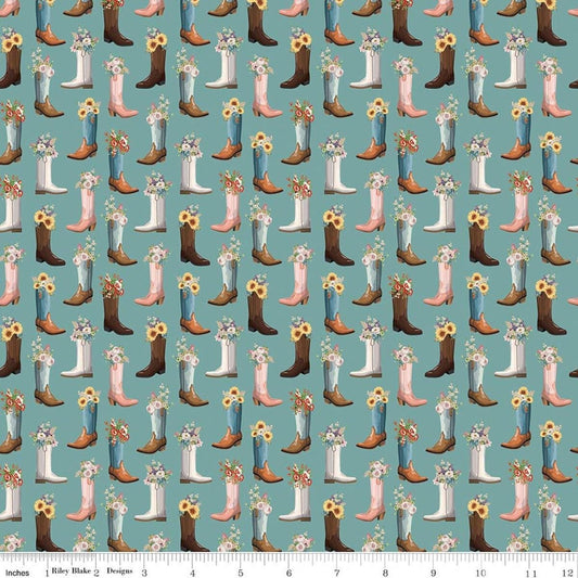 Image of Cowgirl Boots Blue quilting cotton fabric by Echo Park Paper Co. for Riley Blake Designs. Features cowboy boots on a blue background. Cute Little Fabric Shop.