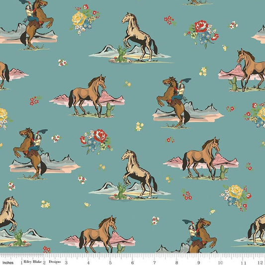 Image of Cowgirl Main Blue quilting cotton fabric by Echo Park Paper Co. for Riley Blake Designs. Features horses on a blue background. Cute Little Fabric Shop.