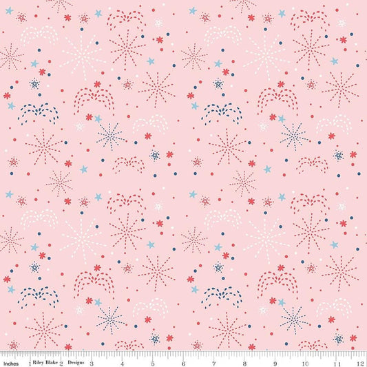 Image of Firework Fields Fireworks Pink quilting cotton fabric by Gracey Larson for Riley Blake Designs. Features fireworks on a pink background. Cute Little Fabric Shop.