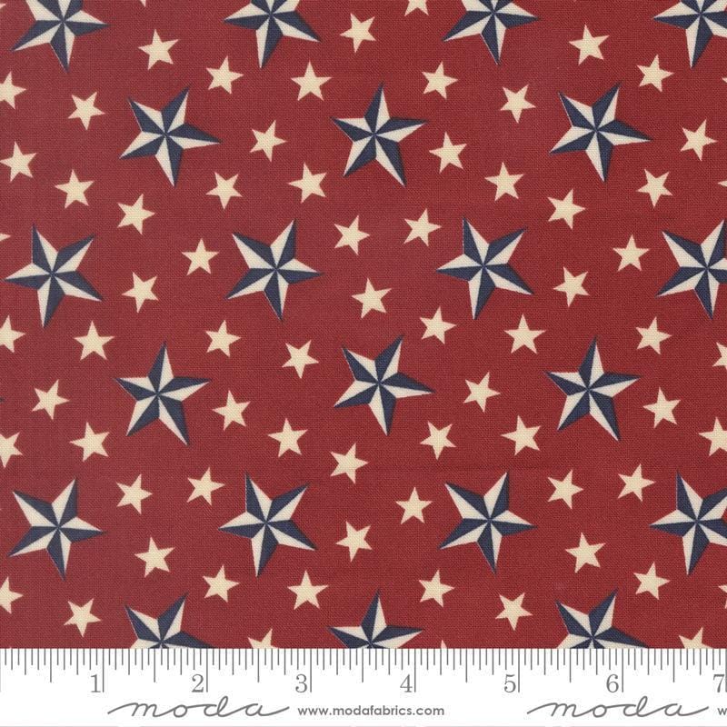 Image of America 250 Years Tossed Stars Brave Crimson quilting cotton fabric by Deb Strain for Moda Fabrics. Features stars on a red background. Cute Little Fabric Shop.