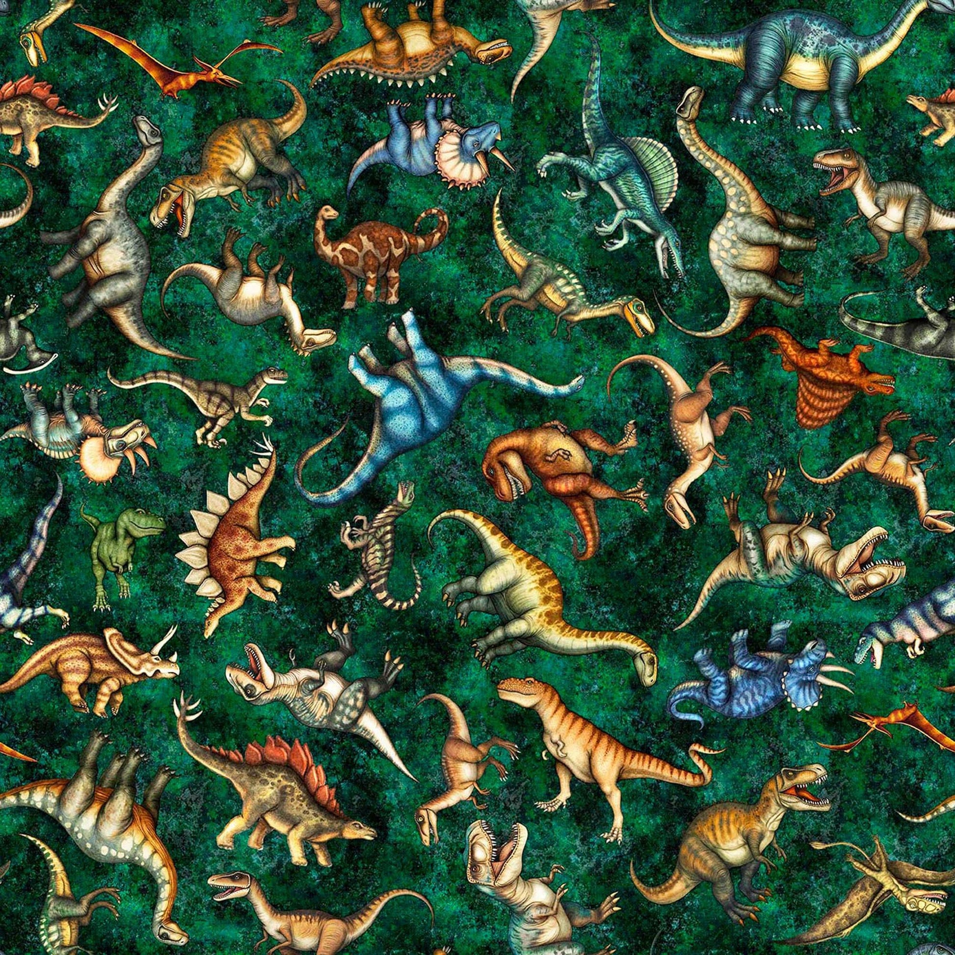 Image of Savage Kingdom Tossed Dinosaurs Forest quilting cotton fabric by Dan Morris for QT Fabrics. Features dinosaurs on a green background. Cute Little Fabric Shop.