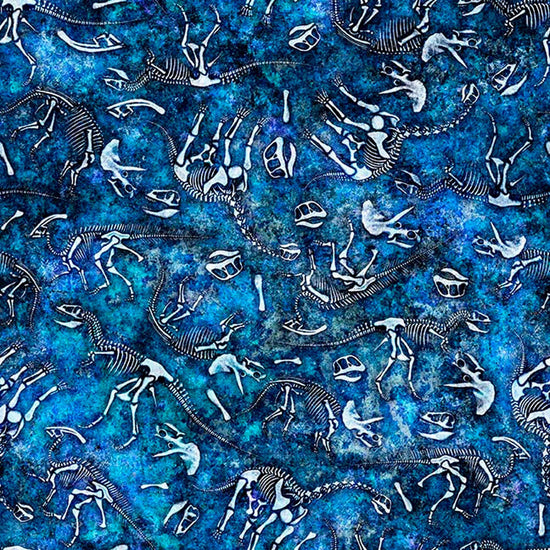 Image of Savage Kingdom Dino Bones Blue quilting cotton fabric by Dan Morris for QT Fabrics. Features dinosaur bones on a blue background. Cute Little Fabric Shop.