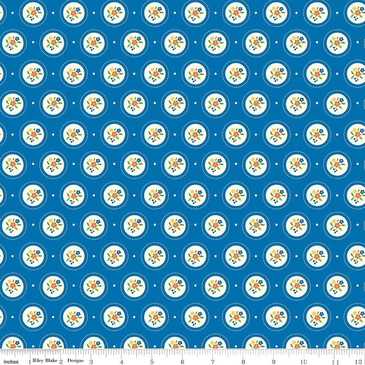 Image of Summer's in Town Cameo Blue quilting cotton fabric by Sandy Gervais for Riley Blake Designs. Features flowers on a blue background. Cute Little Fabric Shop.