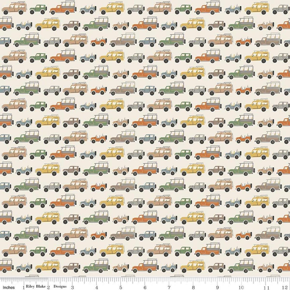 Image of Leo & Savannah Rovers Cream quilting cotton fabric by Deena Rutter for Riley Blake Designs. Features cars on a cream background. Cute Little Fabric Shop.