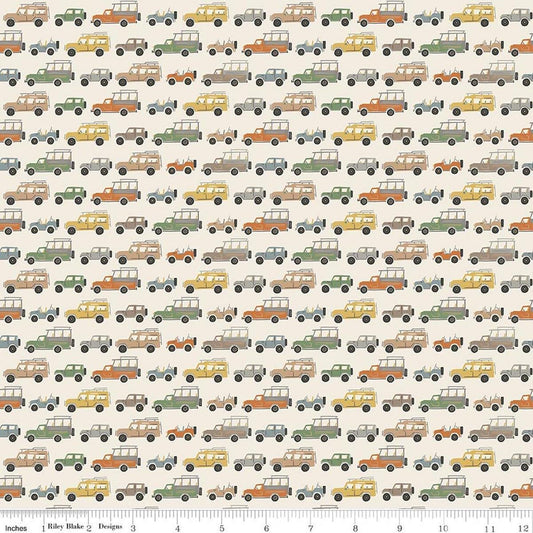 Image of Leo & Savannah Rovers Cream quilting cotton fabric by Deena Rutter for Riley Blake Designs. Features cars on a cream background. Cute Little Fabric Shop.