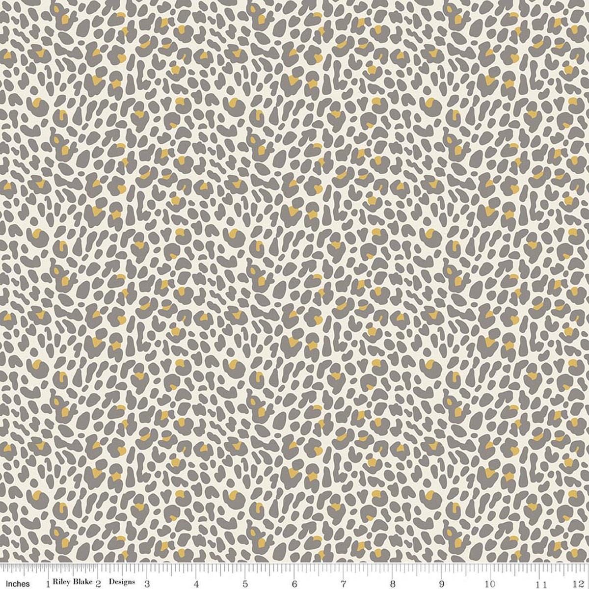 Image of Leo & Savannah Leopard Cream quilting cotton fabric by Deena Rutter for Riley Blake Designs. Features leopard print on a cream background. Cute Little Fabric Shop.