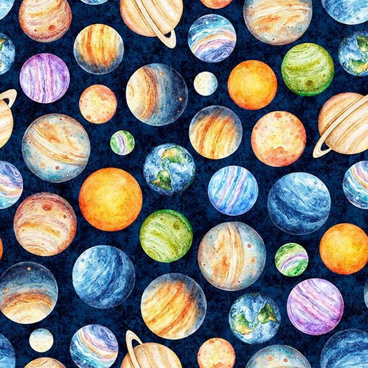 Image of QT Cuties 3 Planets Midnight quilting cotton fabric by Morris Creative Group for QT Fabrics. Features planets on a blue background. Cute Little Fabric Shop.