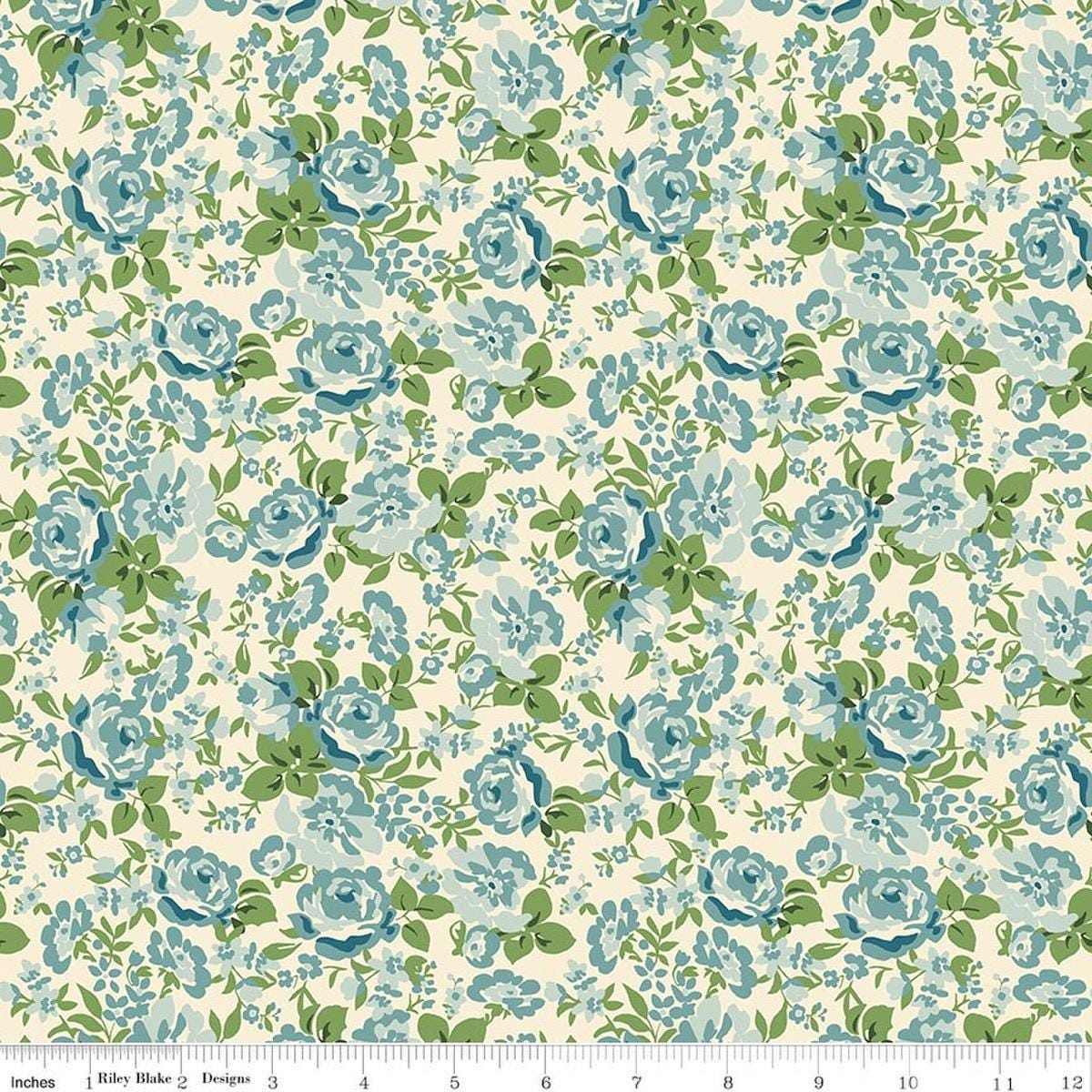 Image of Cowgirl Floral Blue quilting cotton fabric by Echo Park Paper Co. for Riley Blake Designs. Features flowers on a blue background. Cute Little Fabric Shop.