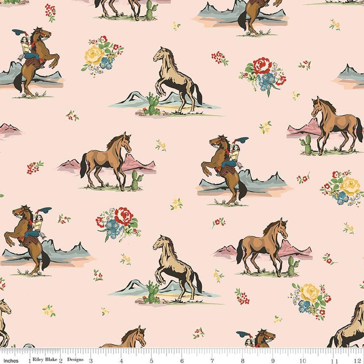 Image of Cowgirl Main Blush quilting cotton fabric by Echo Park Paper Co. for Riley Blake Designs. Features horses on a pink background. Cute Little Fabric Shop.