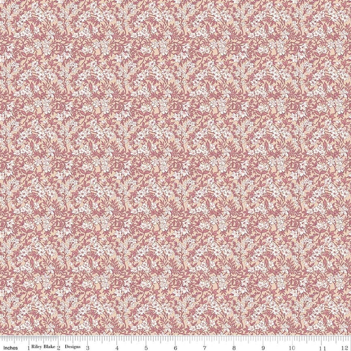 Image of Daybreak on the Prairie Spring Floral Peach quilting cotton fabric by Modern Prairie for Riley Blake Designs. Features flowers on a pink background. Cute Little Fabric Shop.