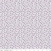Image of Daybreak on the Prairie Ditsy Purple quilting cotton fabric by Modern Prairie for Riley Blake Designs. Features flowers on a purple background. Cute Little Fabric Shop.