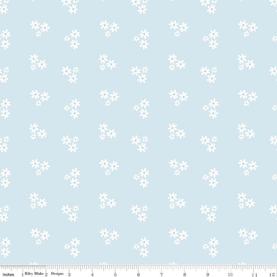 Image of Firework Fields Floral Light Blue quilting cotton fabric by Gracey Larson for Riley Blake Designs. Features flowers on a blue background. Cute Little Fabric Shop.