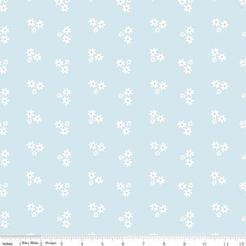 Image of Firework Fields Floral Light Blue quilting cotton fabric by Gracey Larson for Riley Blake Designs. Features flowers on a blue background. Cute Little Fabric Shop.