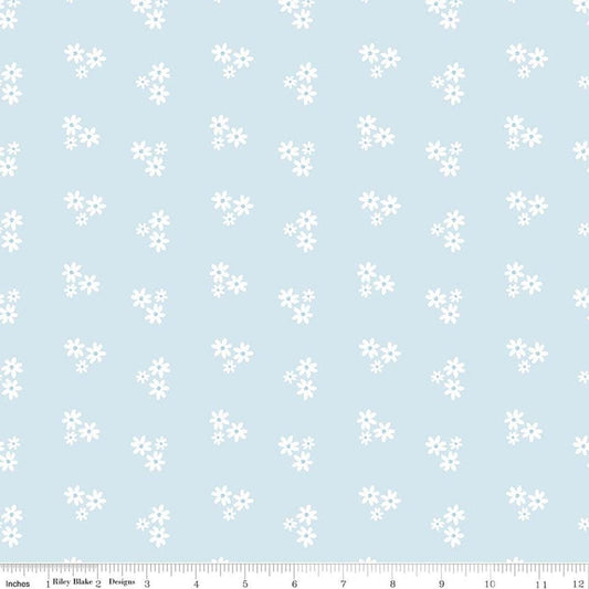 Image of Firework Fields Floral Light Blue quilting cotton fabric by Gracey Larson for Riley Blake Designs. Features flowers on a blue background. Cute Little Fabric Shop.