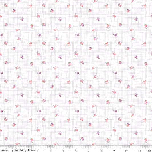 Image of Flourish Ditsy Lilac quilting cotton fabric by Sue Daley for Riley Blake Designs. Features flowers on a white background. Cute Little Fabric Shop.