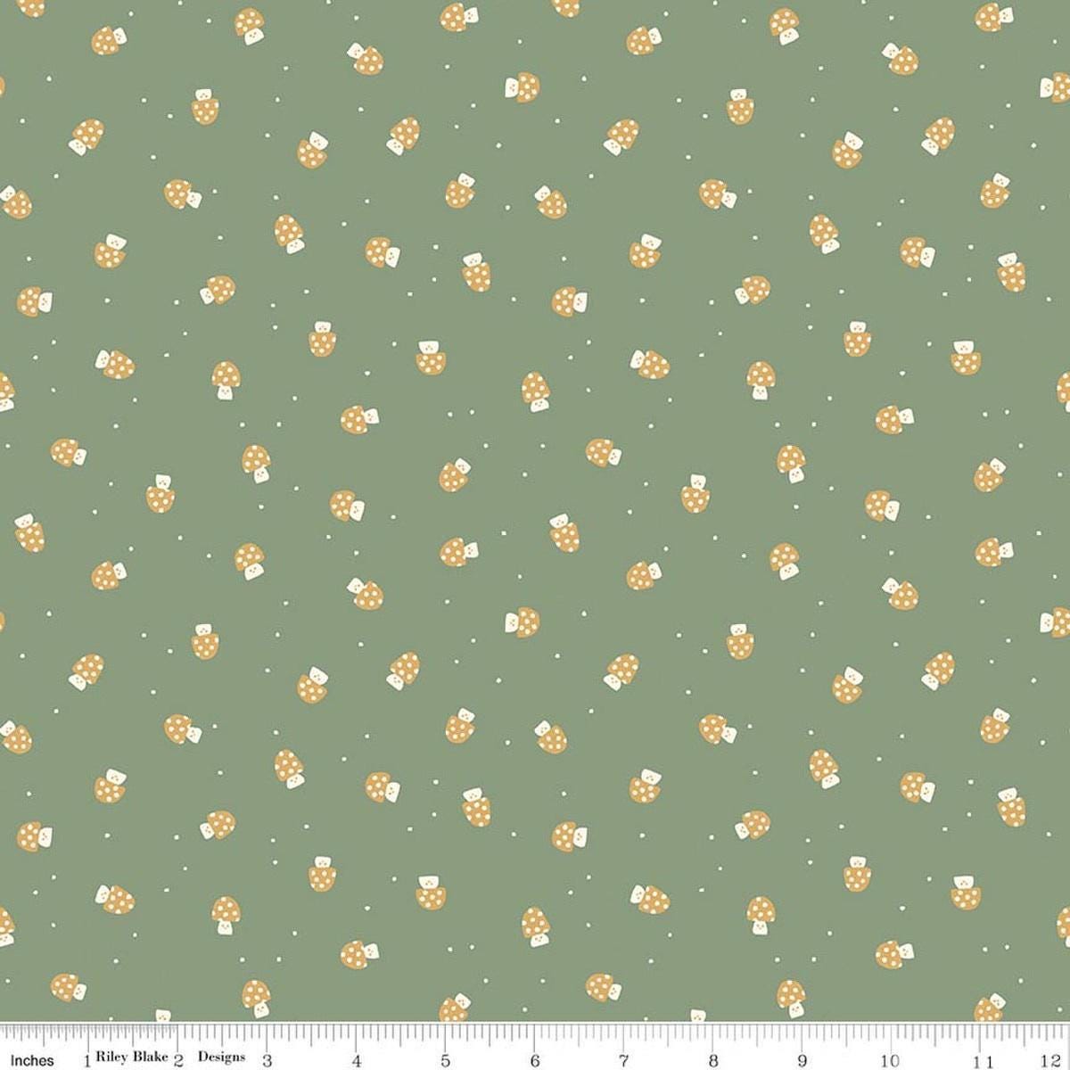 Image of Faraway Kingdom Mushroom Cheer Forest quilting cotton fabric by Natàlia Juan Abelló for Riley Blake Designs. Features mushrooms on a green background. Cute Little Fabric Shop.