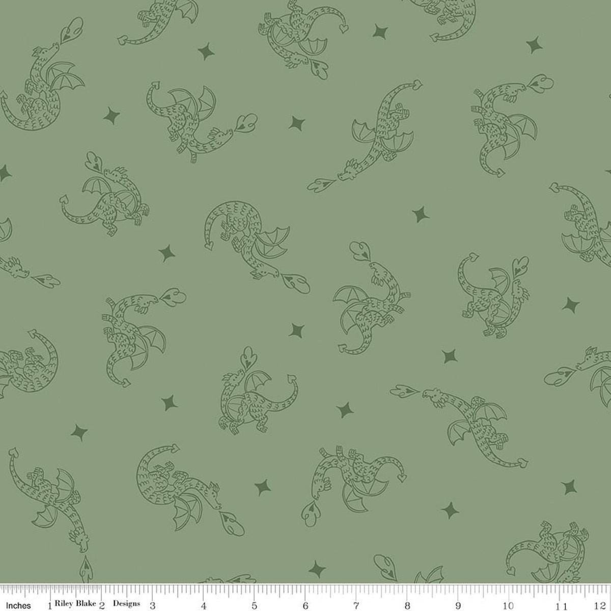 Image of Faraway Kingdom Dragon Flight Forest quilting cotton fabric by Natàlia Juan Abelló for Riley Blake Designs. Features dragons on a green background. Cute Little Fabric Shop.