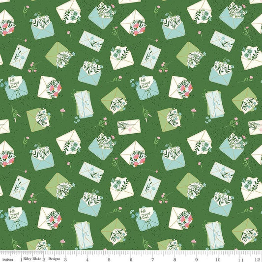 Image of Correspondence Letters Treetop quilting cotton fabric by Beverly McCullough for Riley Blake Designs. Features letters on a green background. Cute Little Fabric Shop.
