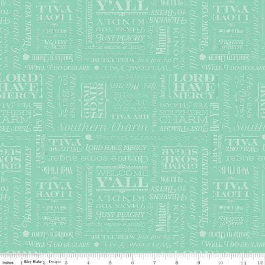 Image of Southern Charm Text Mint quilting cotton fabric by The RBD Designers for Riley Blake Designs. Features words on a green background. Cute Little Fabric Shop.
