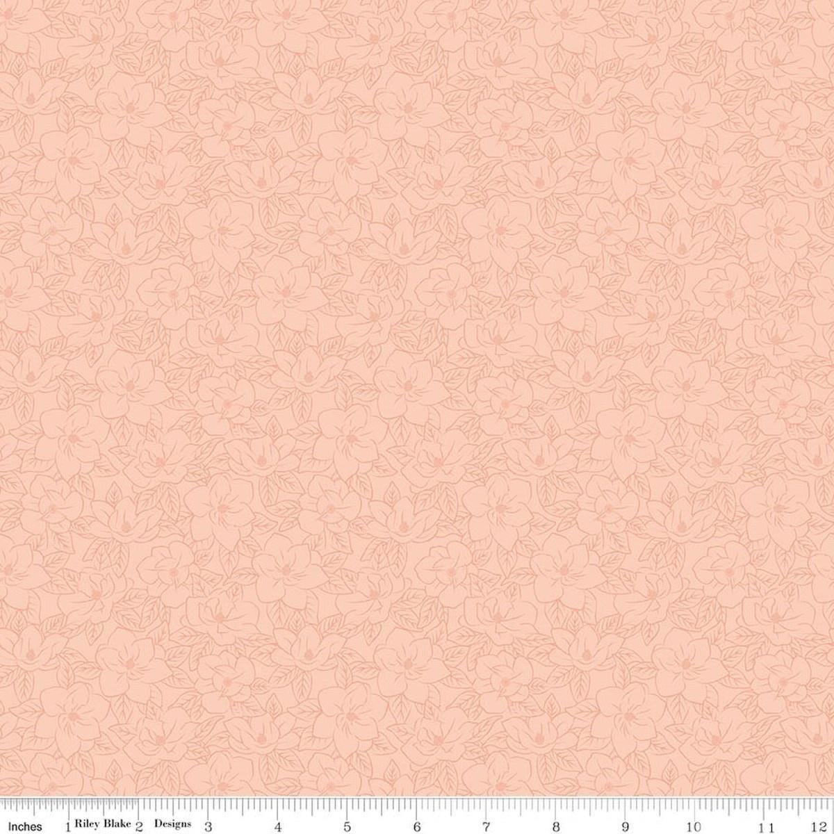 Image of Southern Charm Magnolia Tonal Peaches 'n Cream quilting cotton fabric by The RBD Designers for Riley Blake Designs. Features flowers on a pink background. Cute Little Fabric Shop.