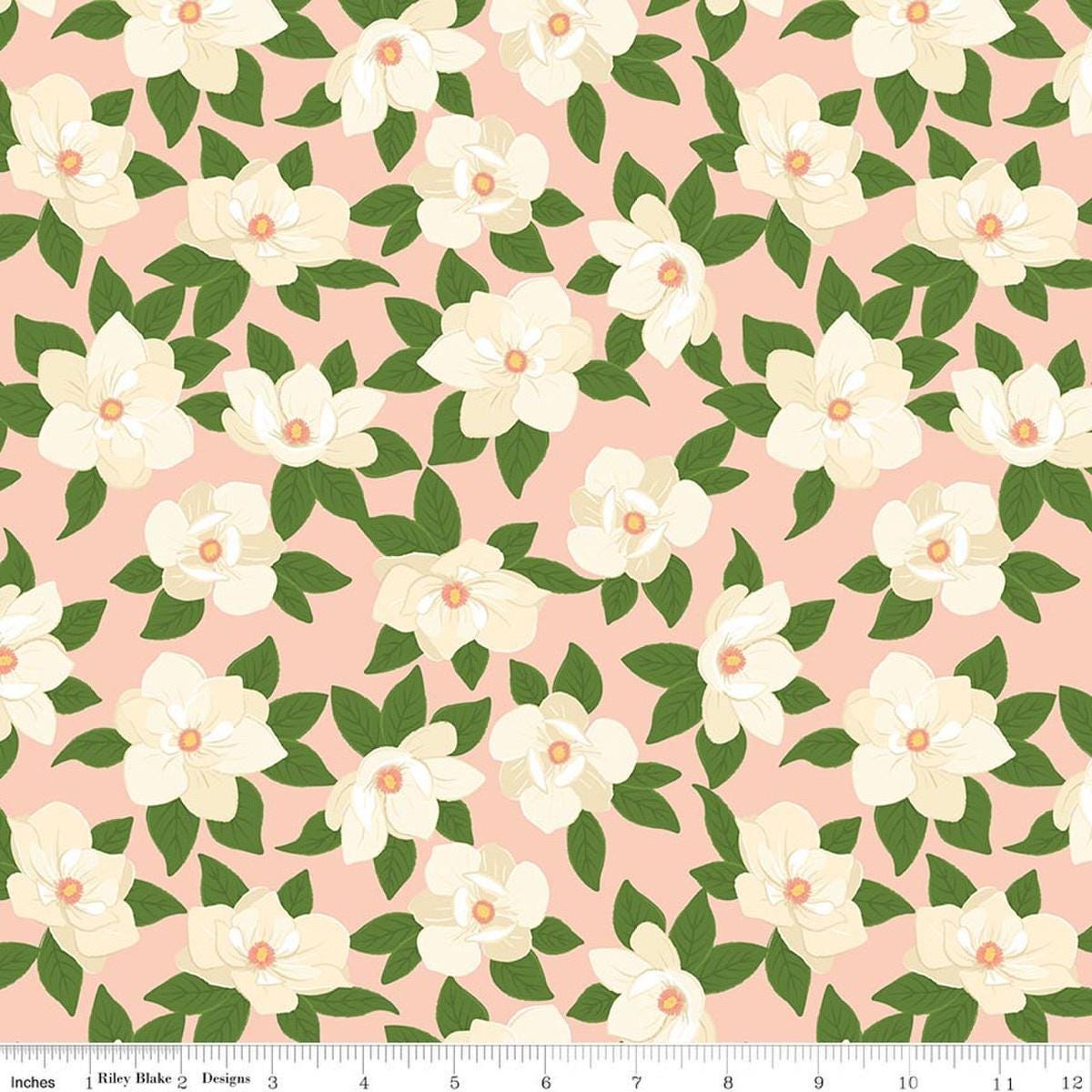 Image of Southern Charm Main Peaches 'n Cream quilting cotton fabric by The RBD Designers for Riley Blake Designs. Features flowers on a pink background. Cute Little Fabric Shop.