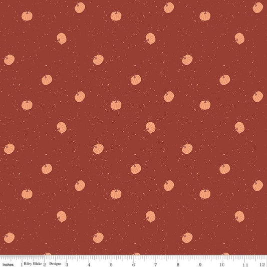 Image of The Apothecary Pumpkin Toss Rust quilting cotton fabric by Amber Elliot for Riley Blake Designs. Features pumpkins on a red background. Cute Little Fabric Shop.