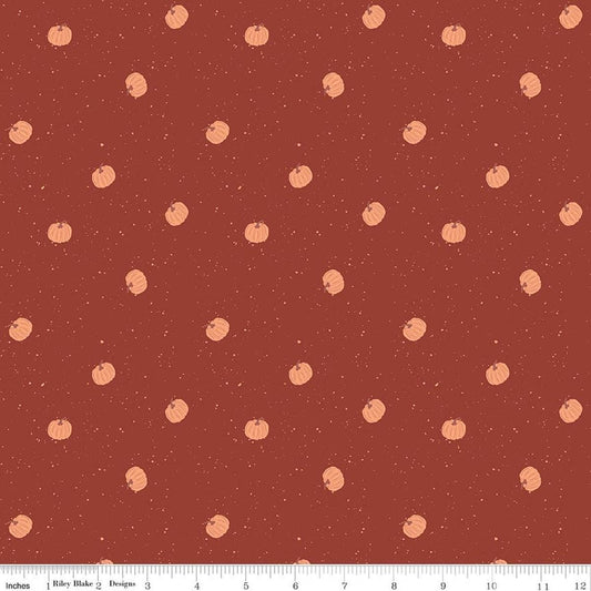 Image of The Apothecary Pumpkin Toss Rust quilting cotton fabric by Amber Elliot for Riley Blake Designs. Features pumpkins on a red background. Cute Little Fabric Shop.