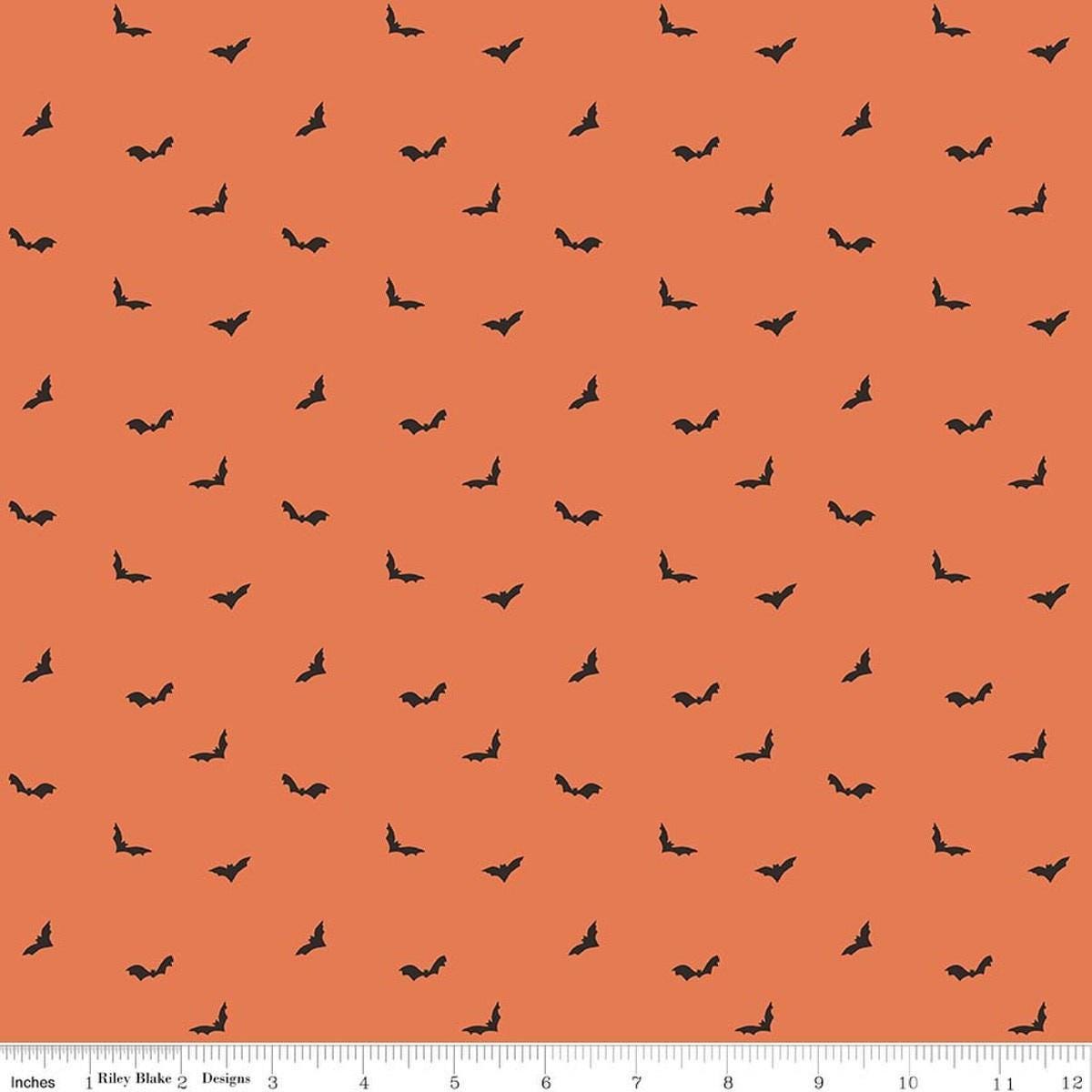 Image of The Apothecary Batwings Marmalade quilting cotton fabric by Amber Elliot for Riley Blake Designs. Features bats on an orange background. Cute Little Fabric Shop.