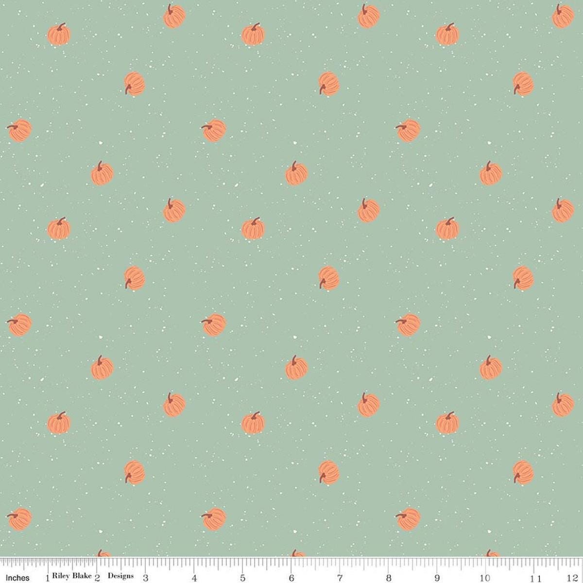 Image of The Apothecary Pumpkin Toss Mint quilting cotton fabric by Amber Elliot for Riley Blake Designs. Features pumpkins on a green background. Cute Little Fabric Shop.