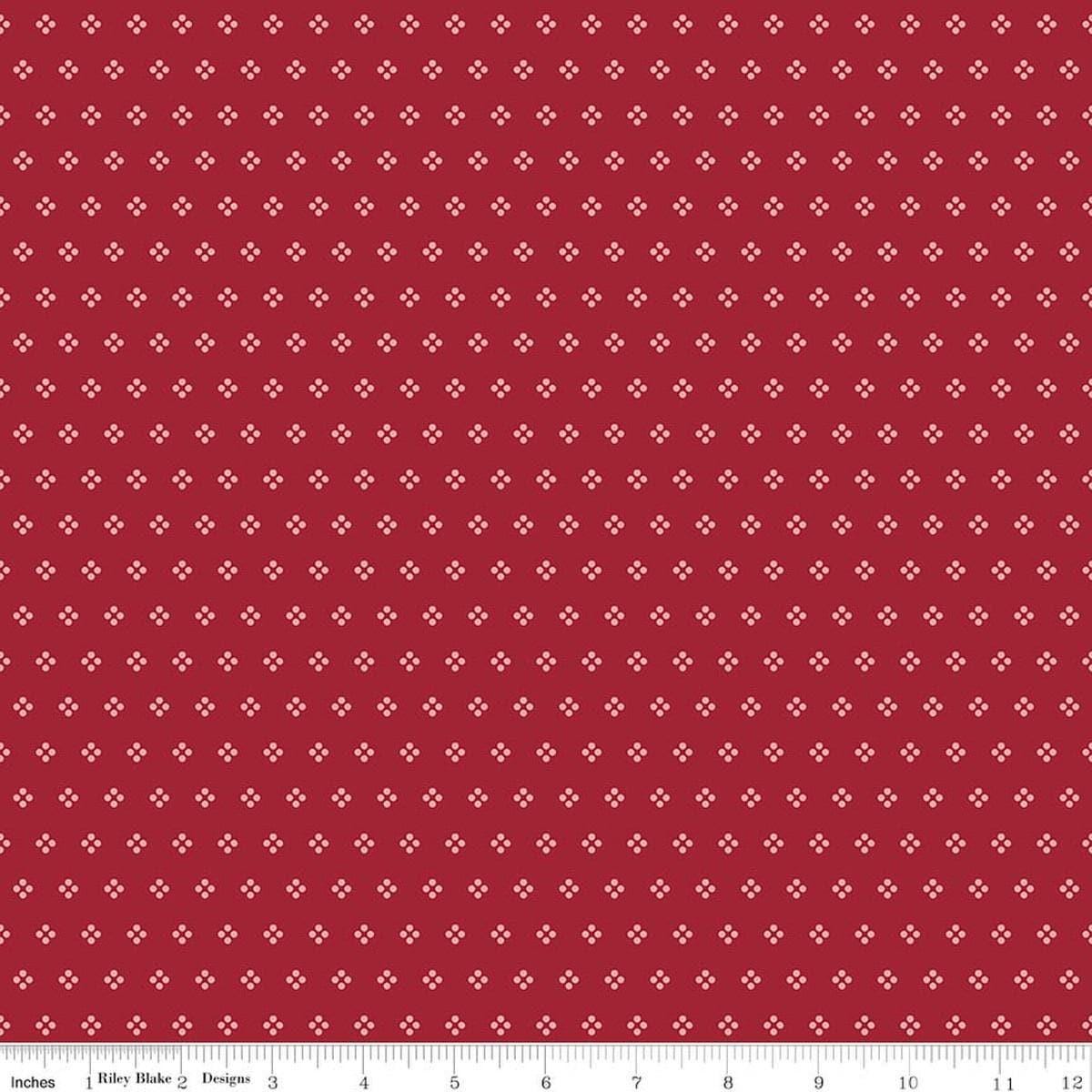 Image of Berry & Sage Eyelet Cherry Tart quilting cotton fabric by Lori Holt for Riley Blake Designs. Features dots on a red background. Cute Little Fabric Shop.