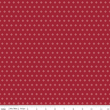 Image of Berry & Sage Eyelet Cherry Tart quilting cotton fabric by Lori Holt for Riley Blake Designs. Features dots on a red background. Cute Little Fabric Shop.