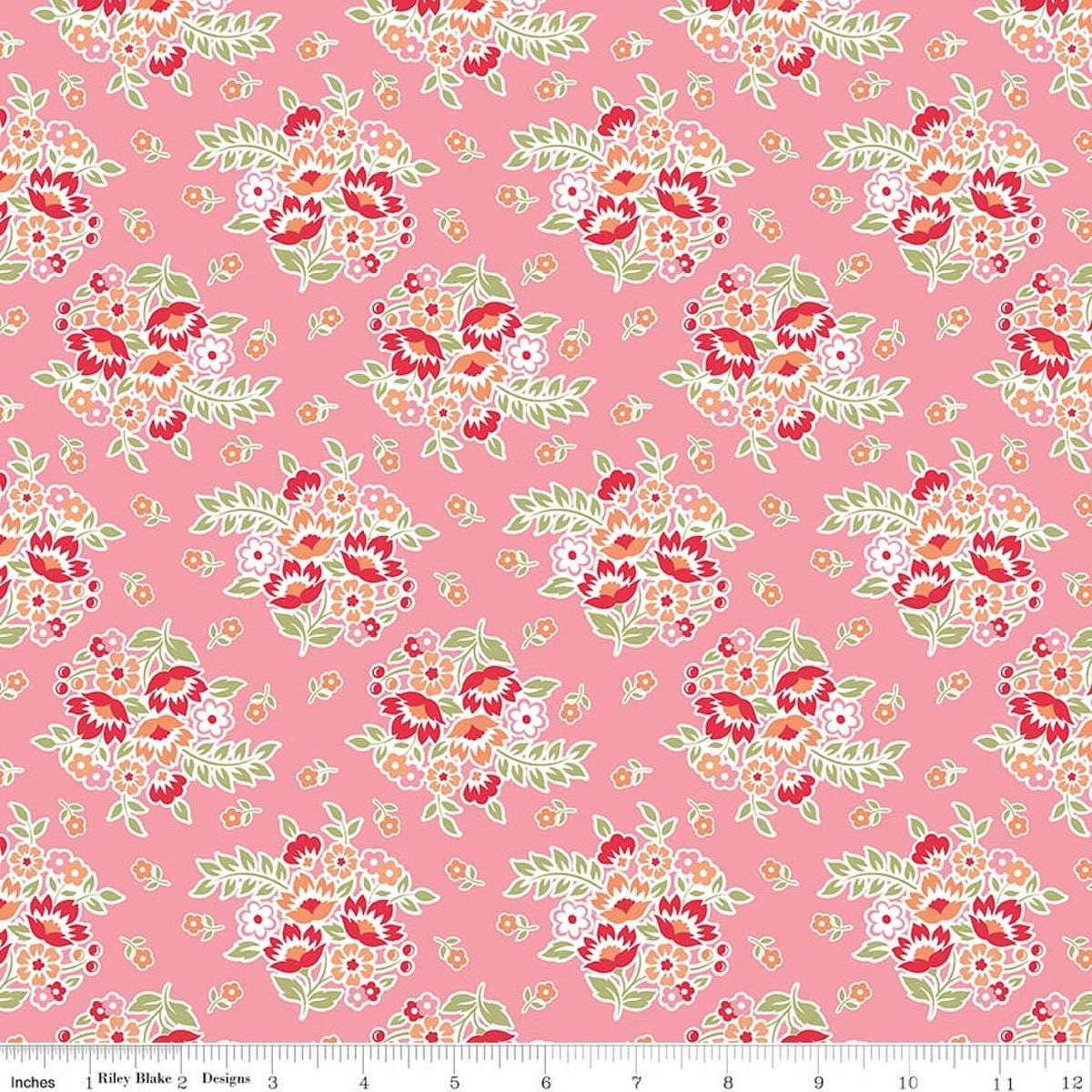 Image of Peach Cobbler Posy Pink quilting cotton fabric by Lily Ashbury for Riley Blake Designs. Features flowers on a pink background. Cute Little Fabric Shop.