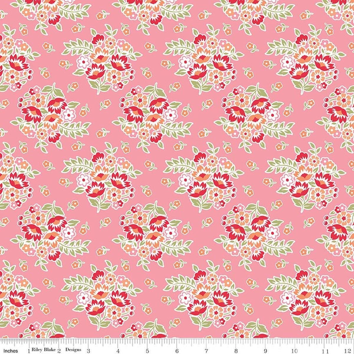 Image of Peach Cobbler Posy Pink quilting cotton fabric by Lily Ashbury for Riley Blake Designs. Features flowers on a pink background. Cute Little Fabric Shop.
